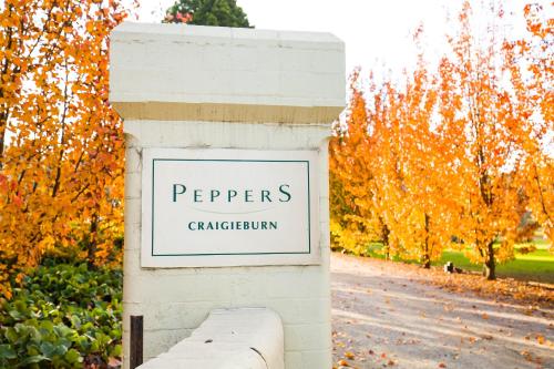a sign that reads pepers carpathian on a white wall at Peppers Craigieburn Resort in Bowral