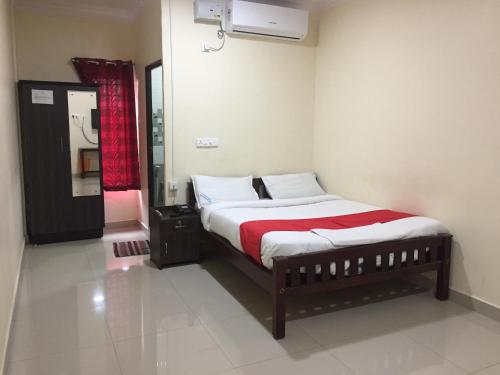Ένα ή περισσότερα κρεβάτια σε δωμάτιο στο Brindavan Residency