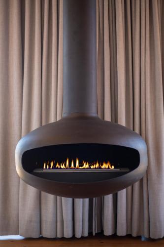 a fireplace is shown in front of a curtain at 57 Waterberg in Welgevonden Game Reserve