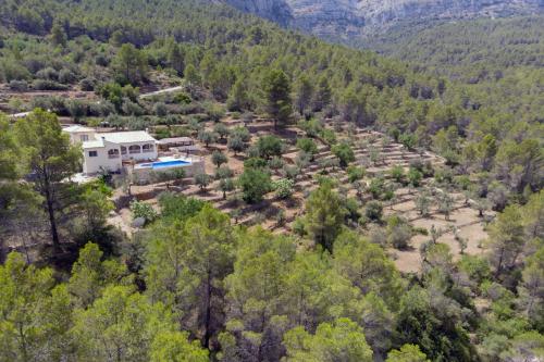 an aerial view of a house in a forest at Villa Foia Vella - adults only in Benichembla
