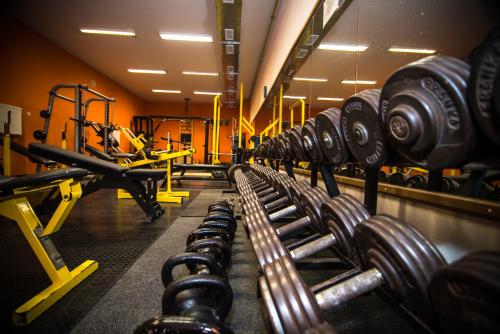 a gym with rows of dumbbells at Penzion Pod zámkom-Boleráz in Boleráz