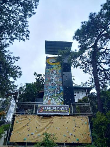 a building with a mural on the side of it at Casa Vallejo Hotel Baguio in Baguio