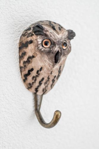 a bird head hanging on a wall at Swiss Lake Lodge in Noville