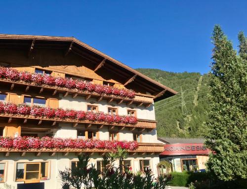 a building with flowers on the side of it at Chalet Tschallener in Ried im Oberinntal