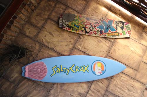 two skateboards sitting on top of a table at Saltycrax Backpackers and Surf Hostel in Bloubergstrand