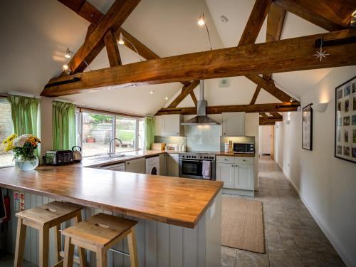 a kitchen with a wooden counter top in a room at Wytons Piece in Cherington