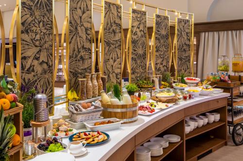 a buffet with food on a long table at Fraser Suites Hamburg in Hamburg