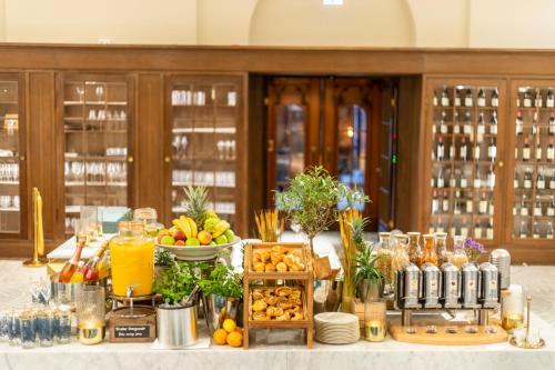 a buffet of food and drinks on a table at Fraser Suites Hamburg in Hamburg
