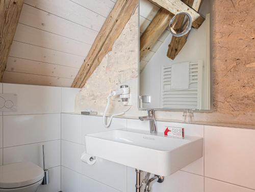 a bathroom with a sink and a mirror at Post Berching in Berching