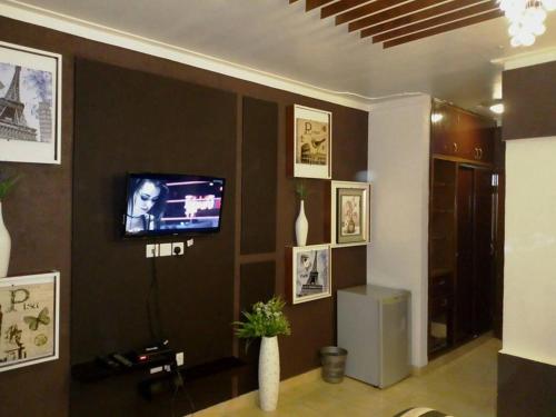 
A television and/or entertainment center at Emerald Hotel Kampala
