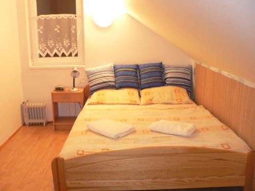 A bed or beds in a room at Chata Bešeňová