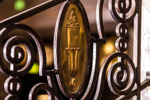 a gold door on a metal fence at Esplanade Zagreb Hotel in Zagreb