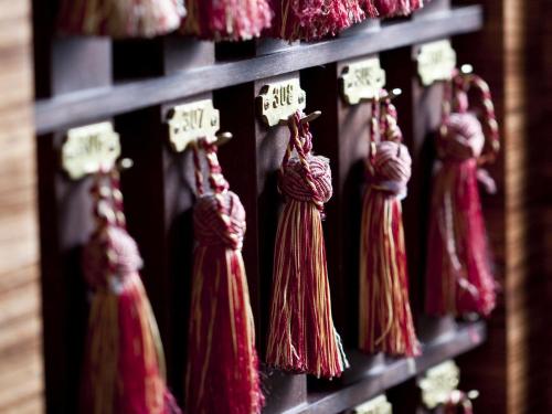 a bunch of red tassels hanging on a shelf at Esplanade Zagreb Hotel in Zagreb