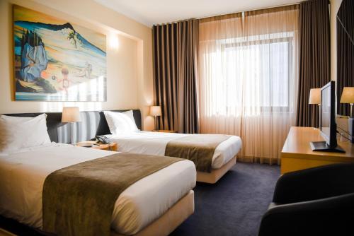 Ένα ή περισσότερα κρεβάτια σε δωμάτιο στο Hotel 3K Barcelona