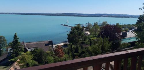 a view of a large body of water from a balcony at TIHANY (BALATON), BEST VIEW, SPACIOUS WELLNESS, CENTRAL , 50m BEACH in Tihany