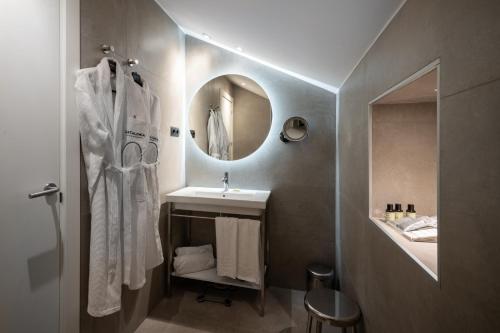 a bathroom with a sink and a mirror at Catalonia Park Putxet in Barcelona