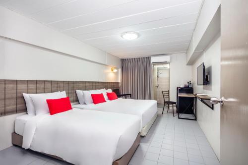 Ένα ή περισσότερα κρεβάτια σε δωμάτιο στο Livotel Express Hotel Ramkhamhaeng 50 Bangkok