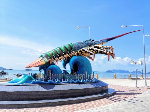 a statue of a lobster on the beach at SER-EN-DIP-I-TY - SHA Extra Plus in Ko Lanta