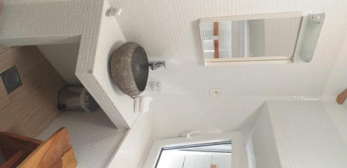 a small bathroom with a sink and a mirror at Boutique Hotel Placa in Krk