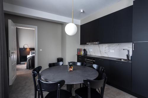 a kitchen with a table and chairs in a room at Reykjavik Residence Apartment Hotel in Reykjavík