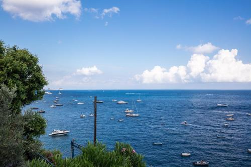 a large body of water with boats in it at RELAIS TRITONE in Nerano