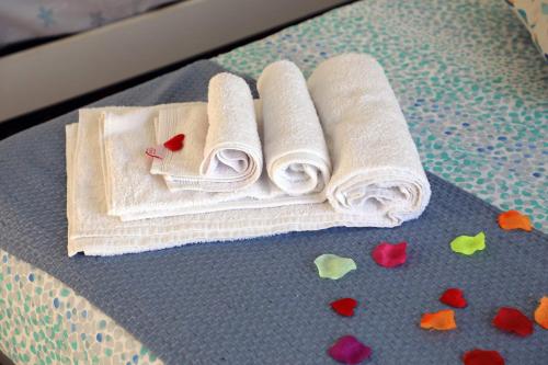 a group of towels sitting on a table with hearts at B&B Vista Mare in Crotone