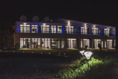 a large building with blue lights on it at night at Cloud 9 Panorama in Eluan