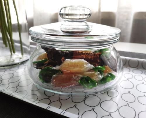 a glass jar filled with food on a table at Gemütliches Apartment mit WLAN in ruhiger Lage! in Dielmissen