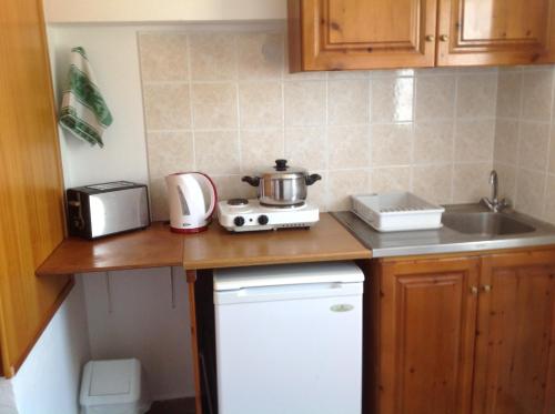 Η κουζίνα ή μικρή κουζίνα στο Nefeli Apartments