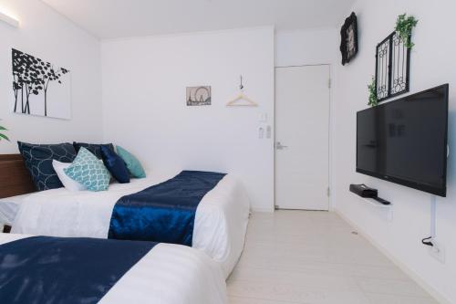 Ένα ή περισσότερα κρεβάτια σε δωμάτιο στο Villa Mahalo ＜1日１組限定＞