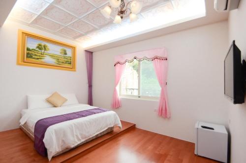 Postel nebo postele na pokoji v ubytování Chuan Der Homestay