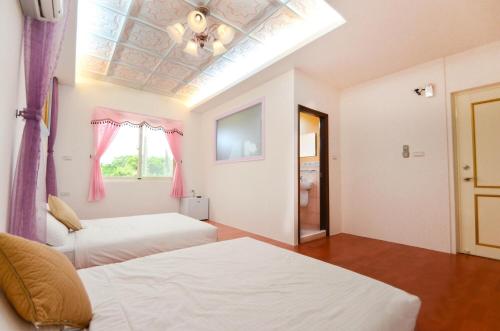 Postel nebo postele na pokoji v ubytování Chuan Der Homestay
