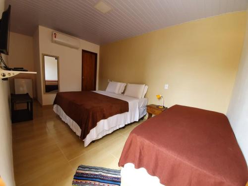 Ένα ή περισσότερα κρεβάτια σε δωμάτιο στο Casa do Maneco