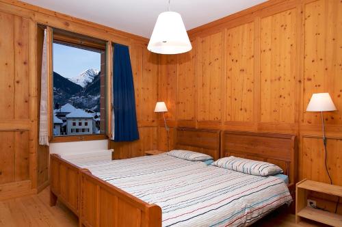 En eller flere senge i et værelse på Hotel La Cascata