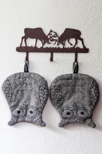 a shelf with two animals on it at Swiss Lake Lodge in Noville