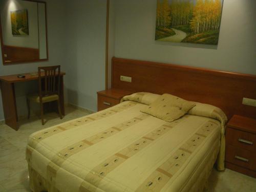 Llit o llits en una habitació de Duque De Osuna