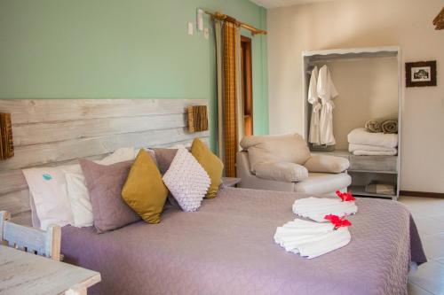 Cama ou camas em um quarto em Pousada Vila Boa Vida