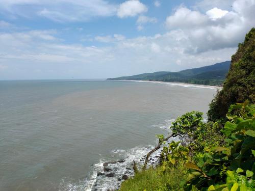 a view of the ocean from a cliff at Shobha Farmhouse in Kashid