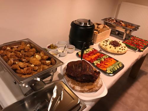 a table with many different types of food on it at Bezručova škola in Staré Hamry