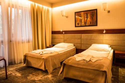 Postel nebo postele na pokoji v ubytování Hotel Relax