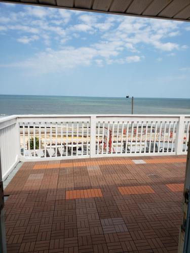 a balcony with a view of the beach at Topaz Motel - Flagler Beach in Flagler Beach