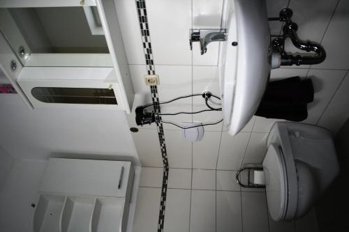 a bathroom with a sink and a toilet at AdBurg-Hom in Homburg