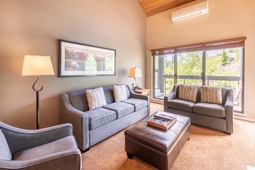 a living room with a couch and two chairs at The Ironwood on Blueberry Hill in Whistler