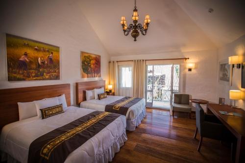 Postel nebo postele na pokoji v ubytování Aranwa Pueblito Encantado del Colca