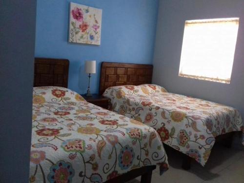 Säng eller sängar i ett rum på Estancia Buen Dia