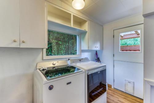 a kitchen with a stove and a sink at Eagle's Nest Retreat in Maple Grove Beach
