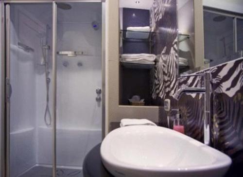 a bathroom with a shower and a toilet and a sink at Relais Villa Fornari in Camerino