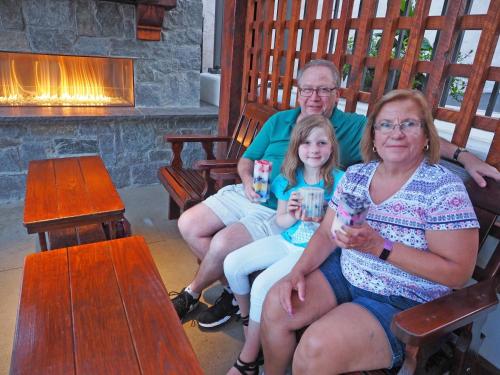 a group of people sitting on a bench at The Lake Motel in Lake George
