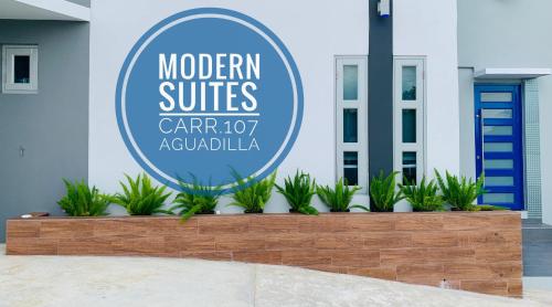 een bord voor een moderne suite autodealer bij Modern Suite #0 - best location in Aguadilla