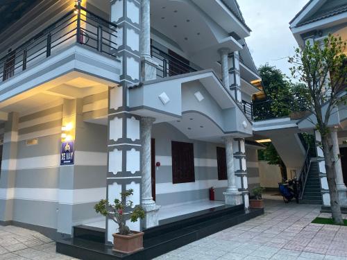 a facade of a house with a staircase at HOTEL AN HOÀ II in Ba Ria
